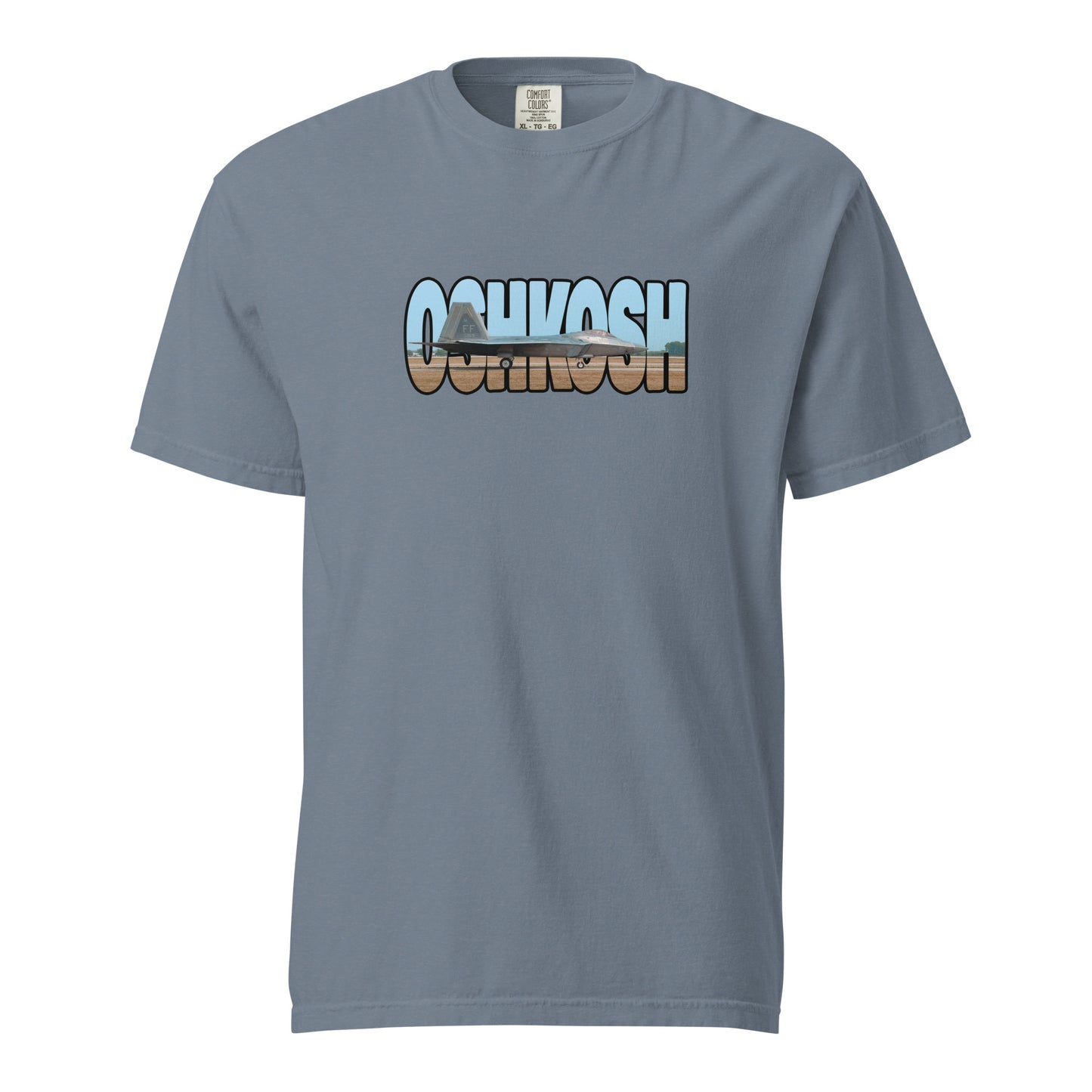 This shirt features an image of an F-22 taxiing at Wittman Regional Airport contained inside of the word "Oshkosh"