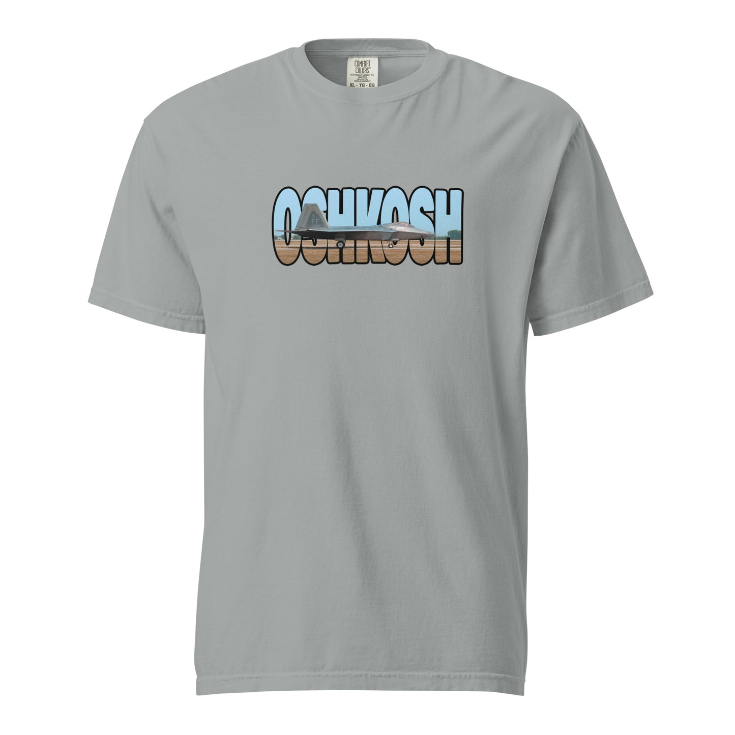 This shirt features an image of an F-22 taxiing at Wittman Regional Airport contained inside of the word "Oshkosh"