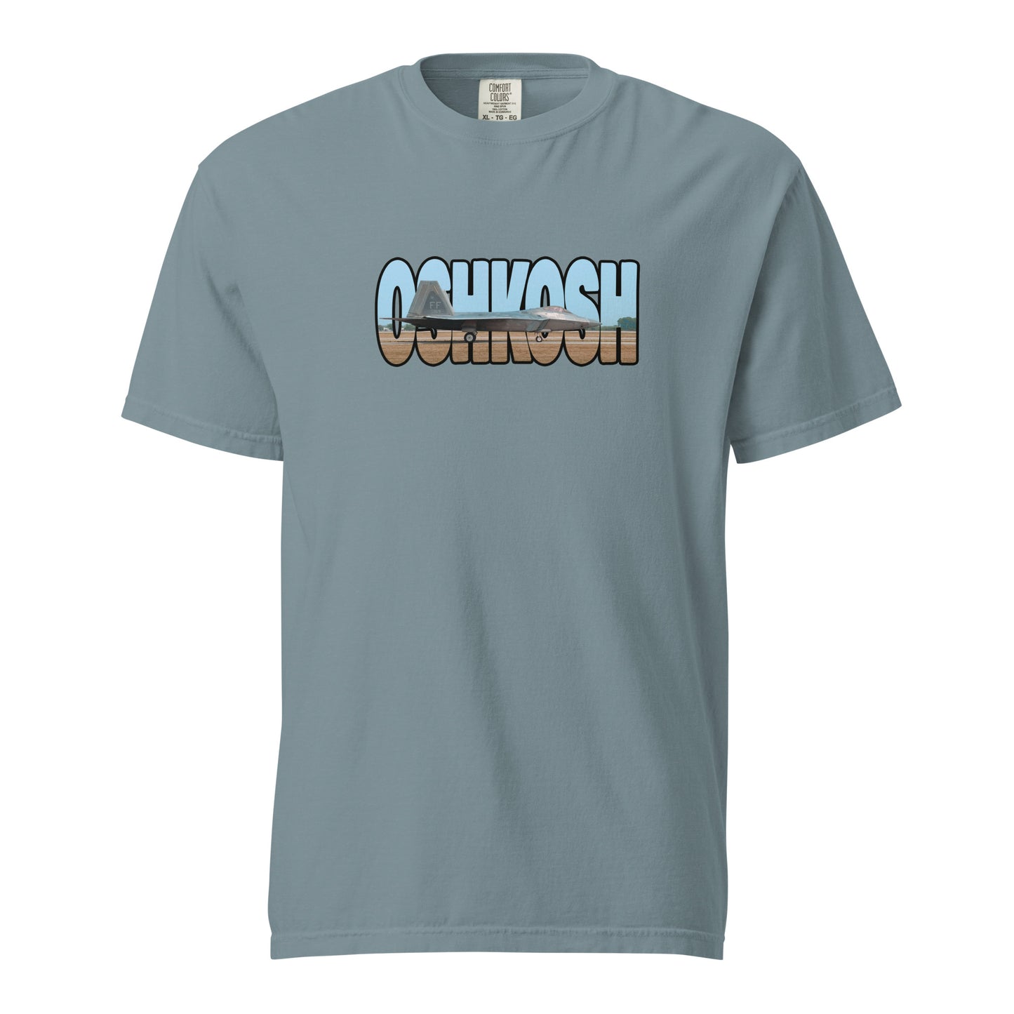 This shirt features an image of an F-22 taxiing at Wittman Regional Airport contained inside of the word "Oshkosh"